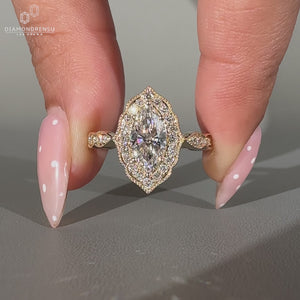 Marquise Diamond Ring With Round Cut Pave Band And Milgrain Details.