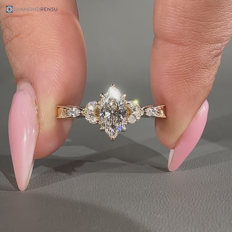 Marquise side stones paired with milgrain details and Muse Setting.