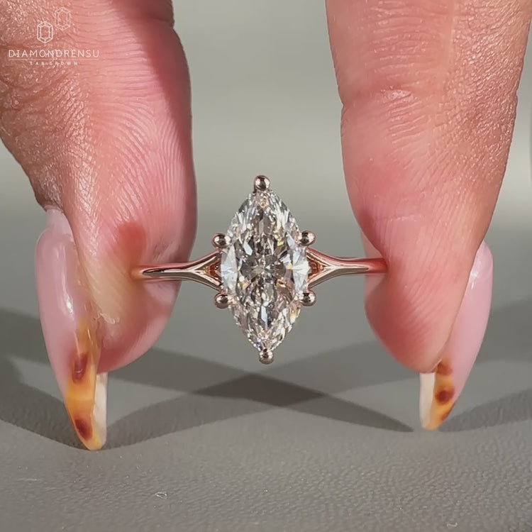Marquise solitaire engagement ring in rose gold.
