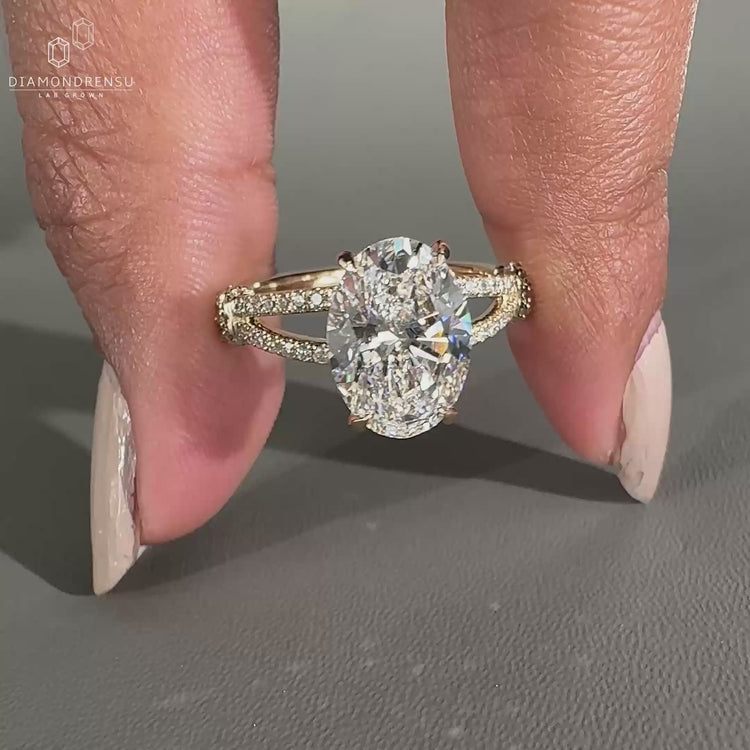 Oval Shaped Engagement Ring with a delicate hidden halo design.
