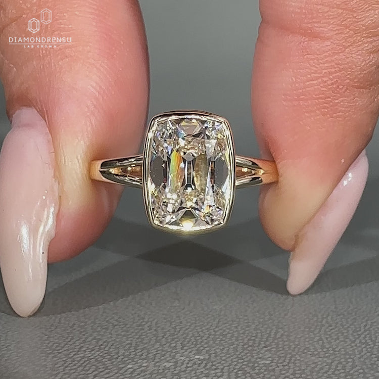 Handmade lab grown cushion diamond ring with split shank band.