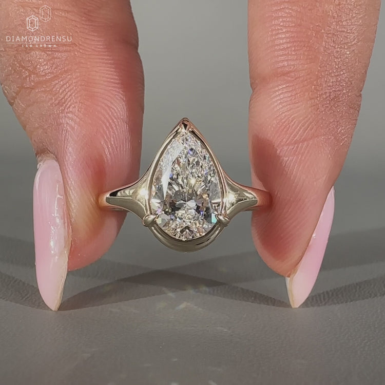 Pear Diamond Ring handmade in yellow gold setting.
