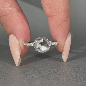 Round rose cut ring with pave setting and open gallery design.
