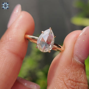 Solitaire moissanite ring with a 5 prong setting in yellow gold.
