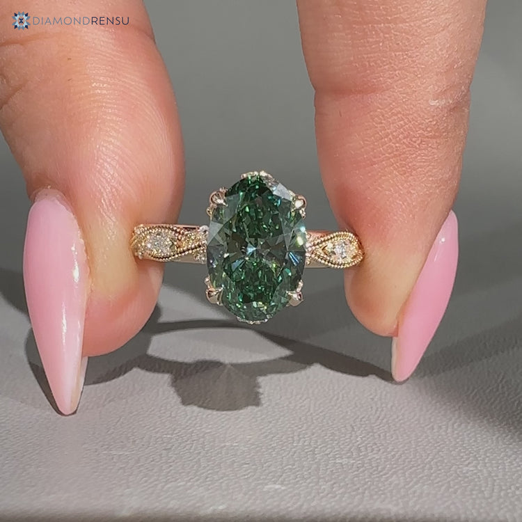 Lab grown oval diamond ring with round side stones and marquise outline.