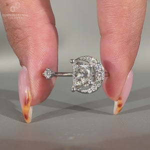 Open gap ring featuring a round side stone design.
