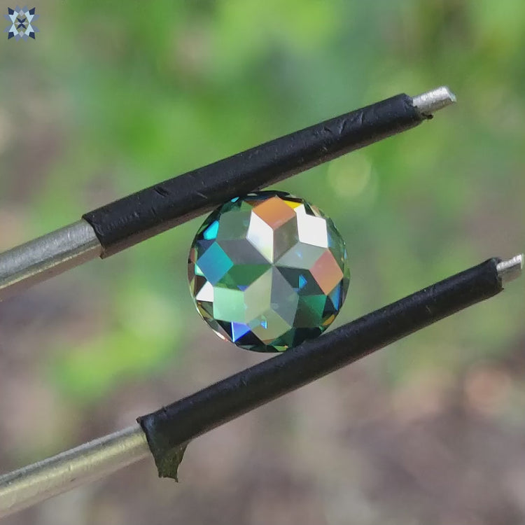 Round rose cut moissanite shown in aqua green color as a loose 2 carat moissanite stone.