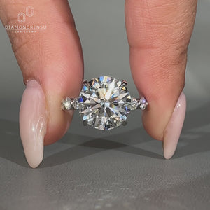Round diamond engagement ring with hidden halo.
