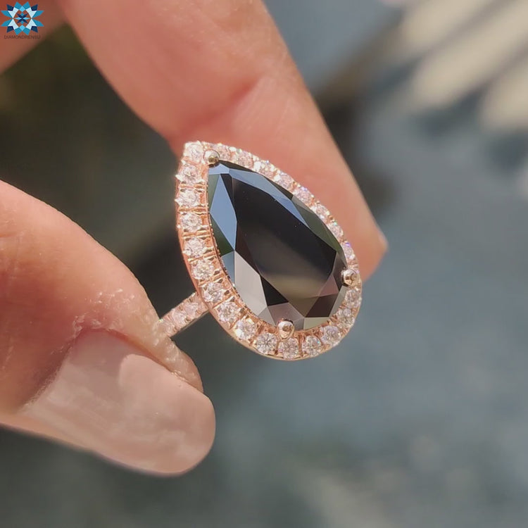 Pear cut moissanite ring shines with brilliant clarity.
