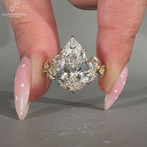 Nature inspired pear cut lab grown diamond engagement ring.

