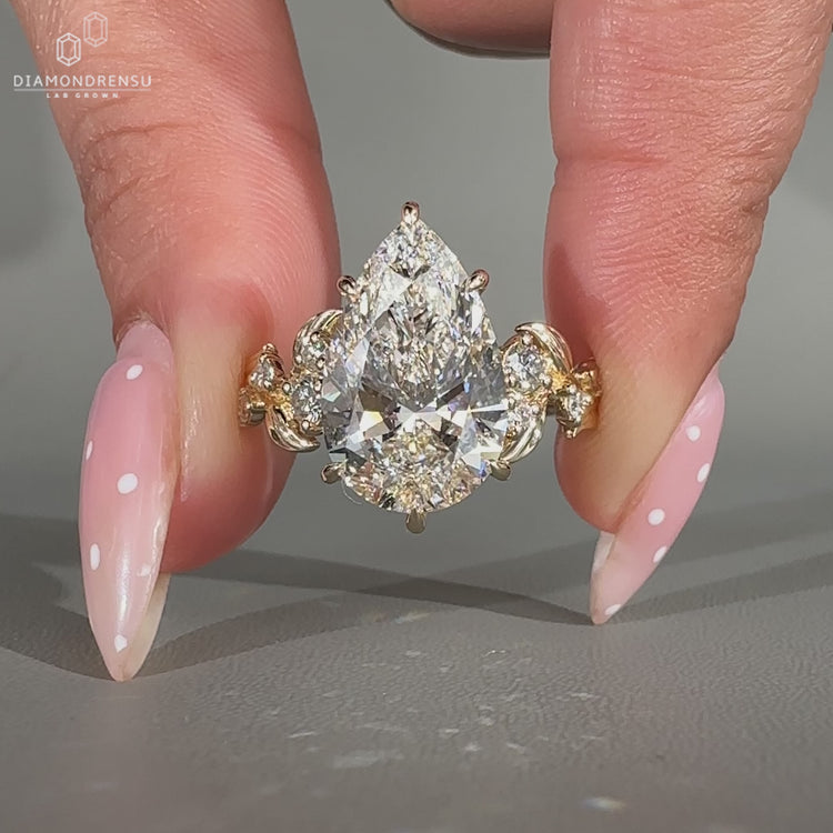 Nature inspired pear cut lab grown diamond engagement ring.
