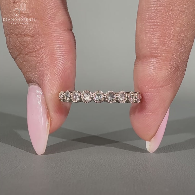 Shared prong rose gold wedding band.
