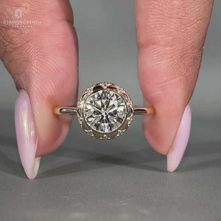 Round Cut Diamond Ring featuring a tapered ring shank for a sleek design.
