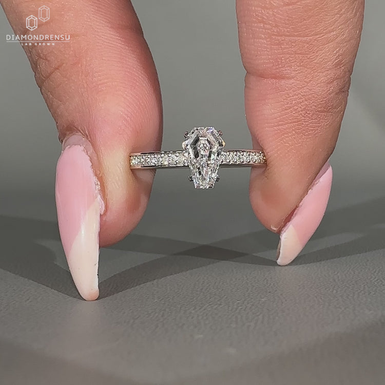 Lab grown coffin cut diamond ring with hidden halo design.