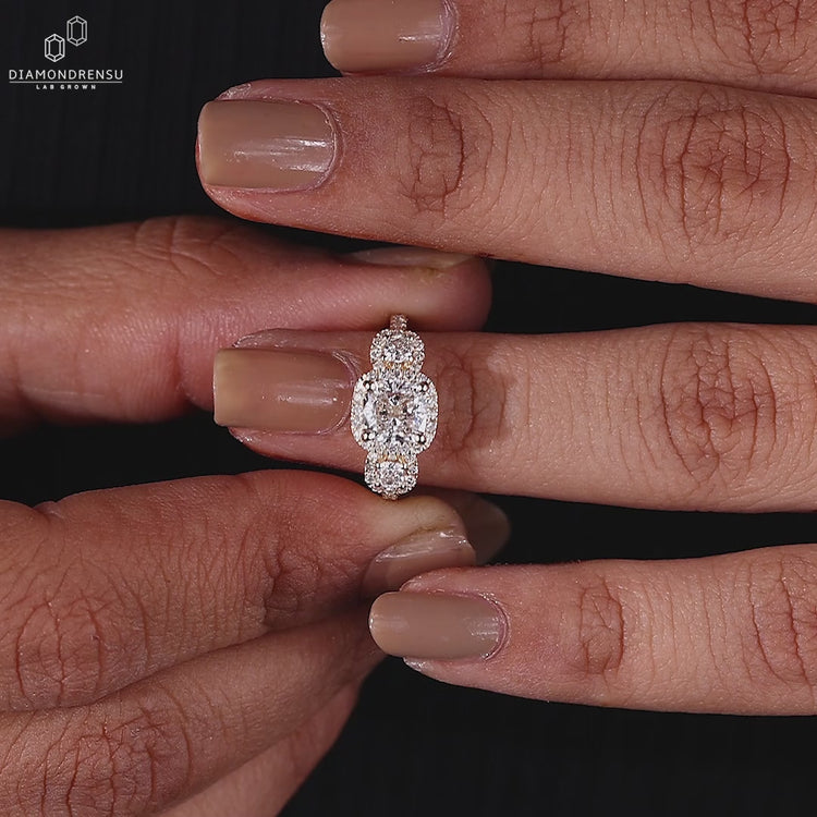 3 Stone Ring designed with a classic halo diamond ring setting.