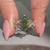 Dutch marquise engagement ring in green.