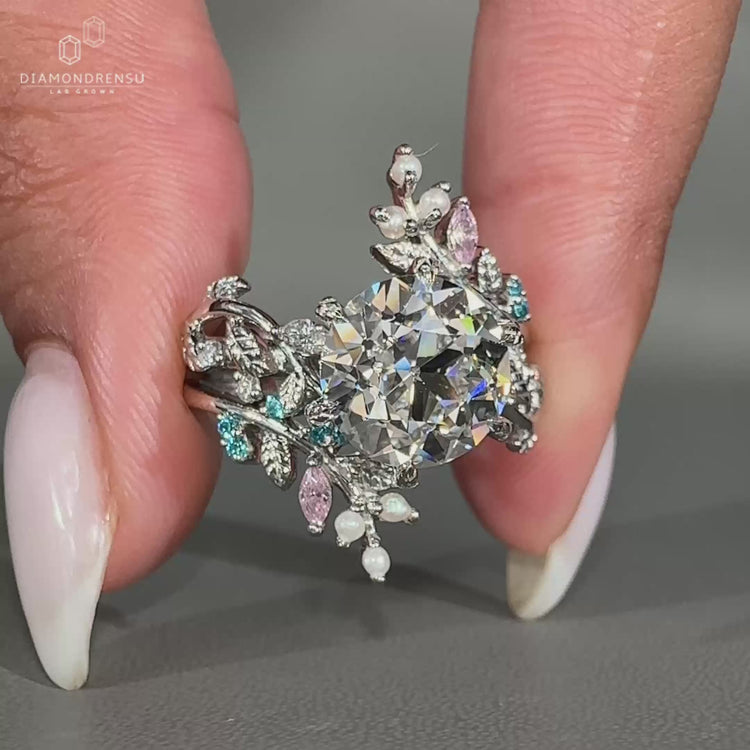 Marquise diamond ring with six leaf style prong setting.
