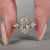 Marquise diamond ring in yellow gold with tapered shank design.
