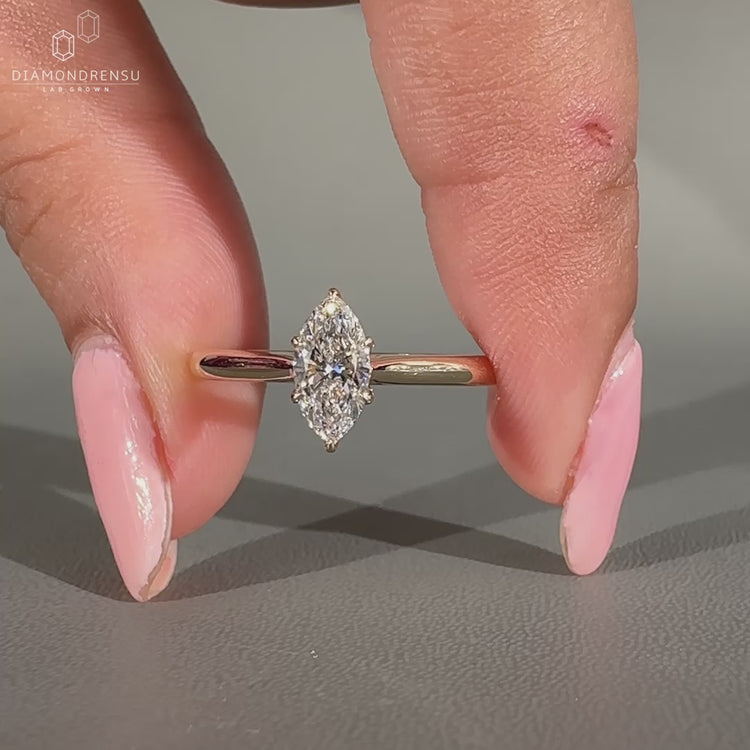 Handmade marquise diamond ring featuring a 6 prong claw setting.
