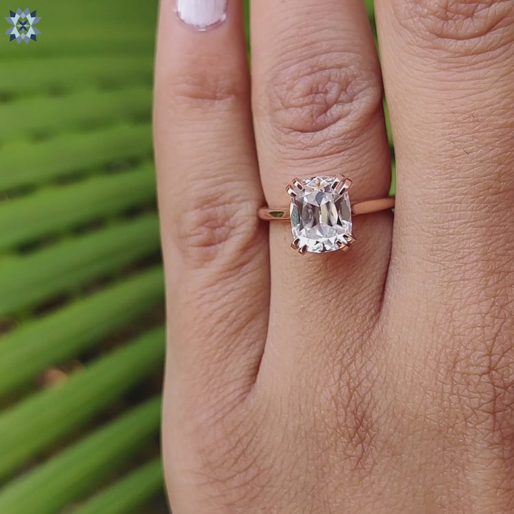 Cathedral setting ring with a stunning cushion cut moissanite stone.
