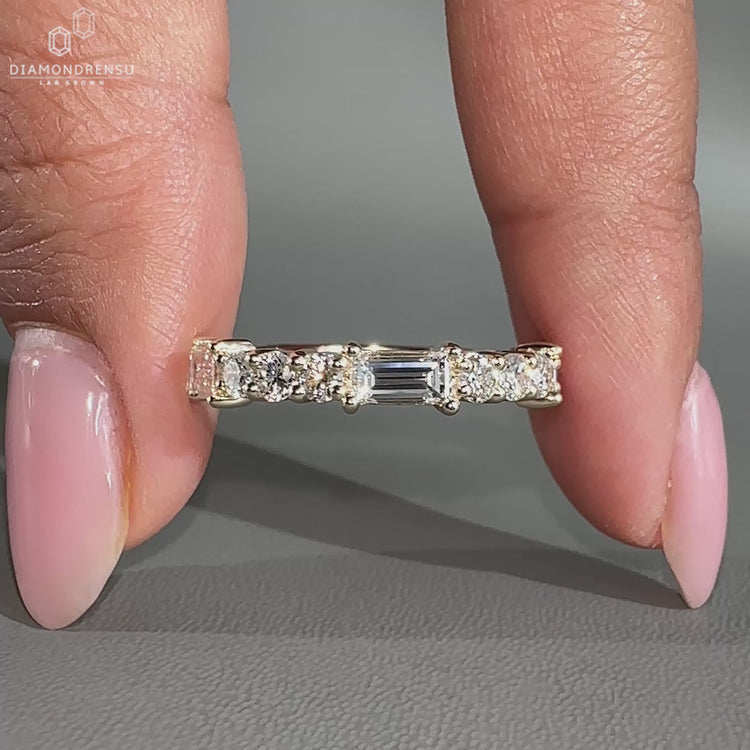 Baguette and round diamond band with sparkle.
