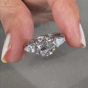 Three stone engagement ring featuring exquisite details.
