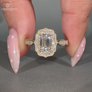 Emerald Cut Diamond Ring With Round Diamond Halo Setting.