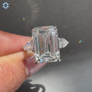 10 carat emerald cut diamond ring with round cut pave band.
