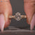 Art deco oval diamond ring with vintage details.