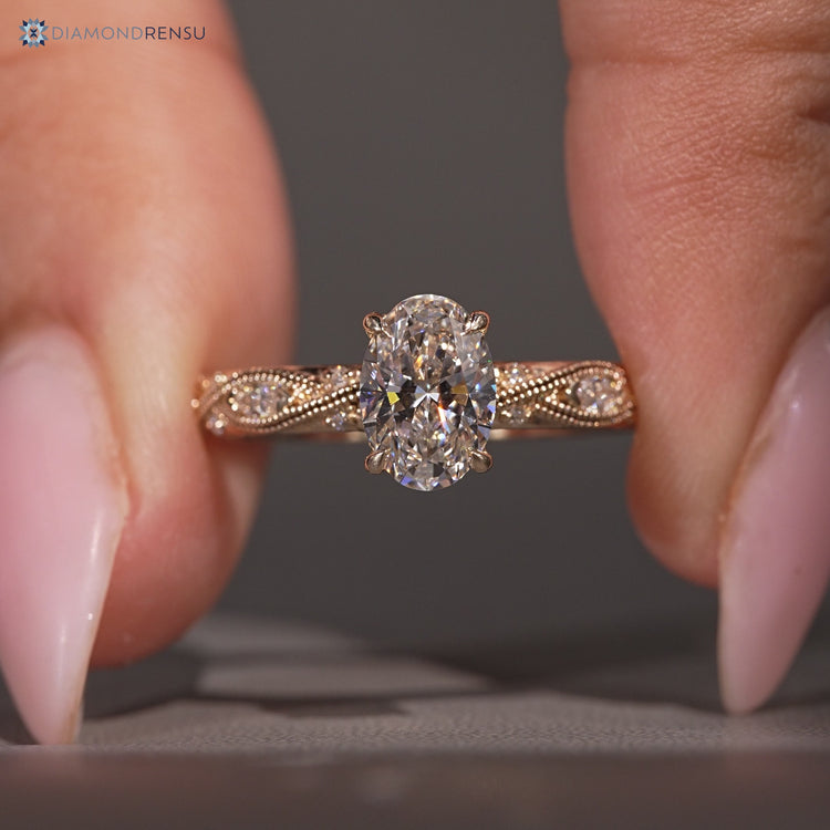 Art deco oval diamond ring with vintage details.