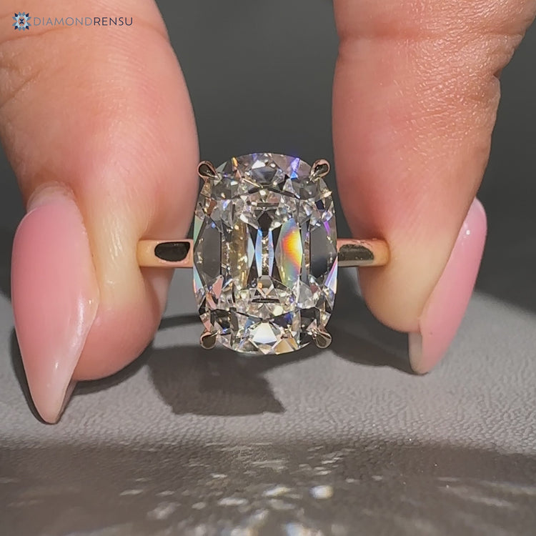 Cushion old mine cut ring in a solitaire style.