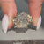 Radiant engagement ring with a twisted shank.