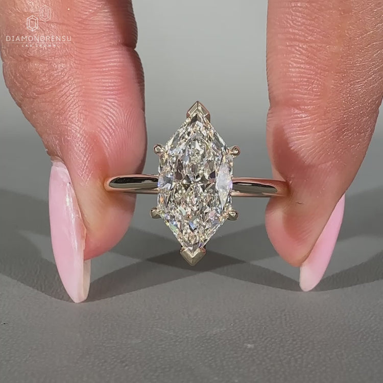 Dutch marquise diamond ring with a hidden halo design.
