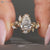 Pear cut lab grown diamond ring with marquise stones.