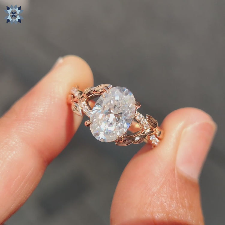 Moissanite oval ring with leaf design.

