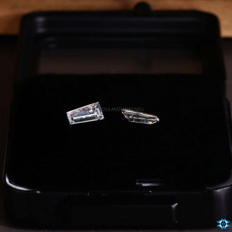 Loose Moissanite pair in tapered baguette shape.
