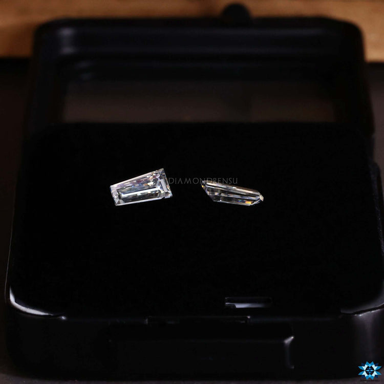 Loose Moissanite pair in tapered baguette shape.
