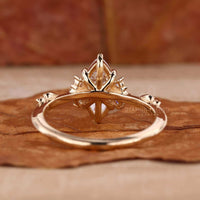 A collection of vintage marquise engagement rings with various designs, including knife edge bands and intricate miligrain detailing.