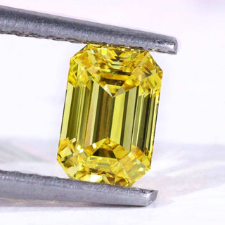 Yellow emerald cut diamond 0.70 carat loose stone.
