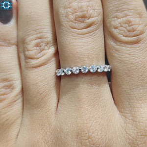 Stunning moissanite eternity band with a full circle of sparkling stones for endless beauty.