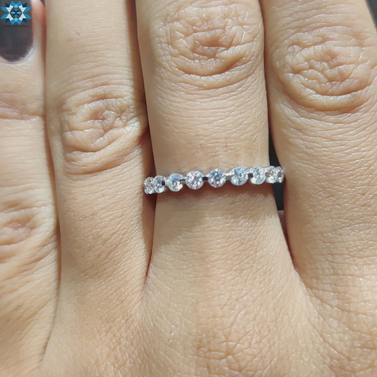 Stunning moissanite eternity band with a full circle of sparkling stones for endless beauty.