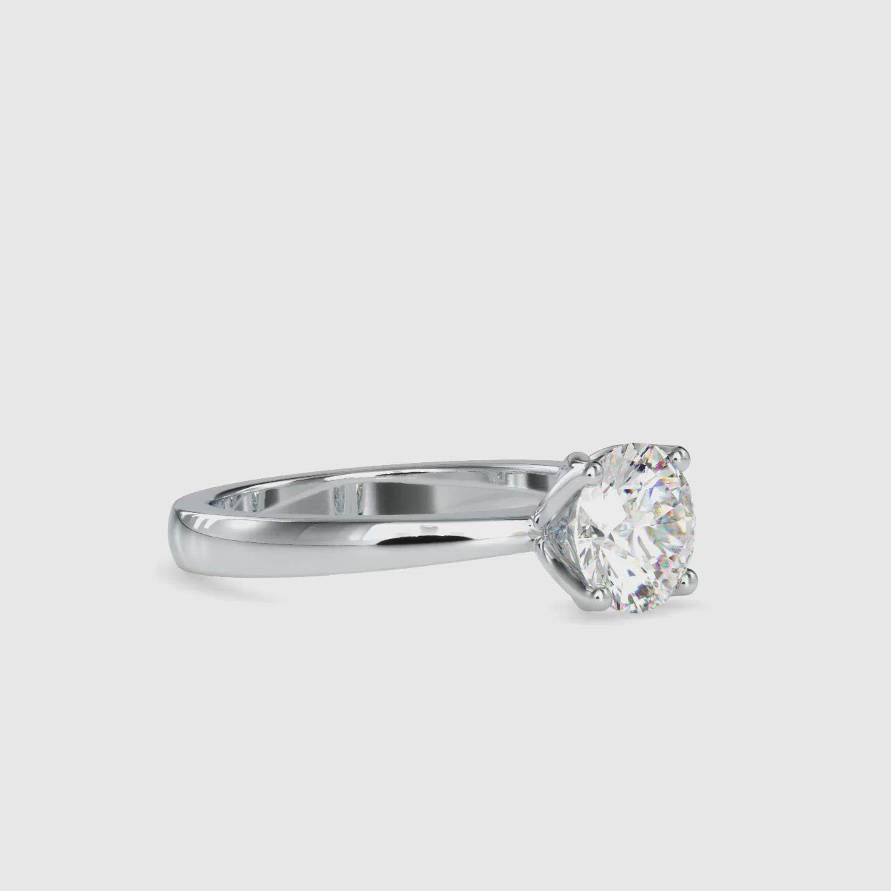 Elegant diamond solitaire ring in white gold and rose accents.