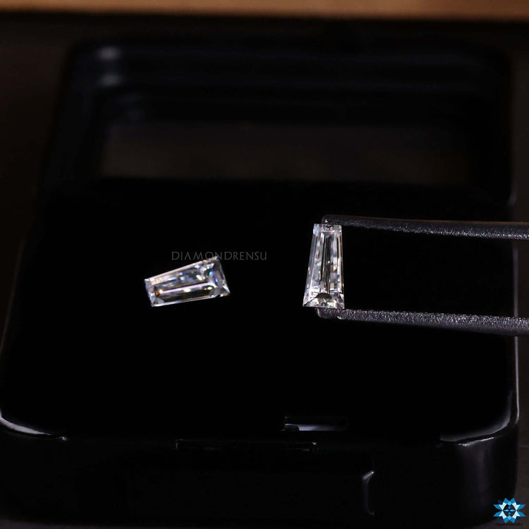 0.61 total carat tapered baguette cut moissanite pair.
