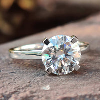 Cathedral setting engagement ring with intricate details.