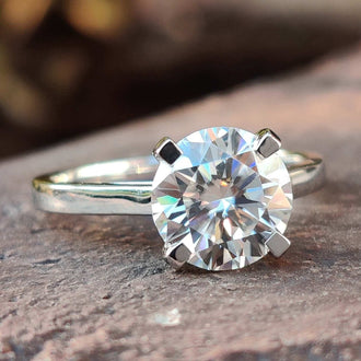 Cathedral setting engagement ring with intricate details.