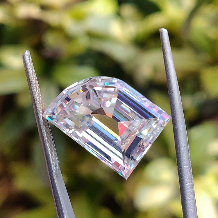 Elephant tooth cut moissanite with antique cut details in a 6.57 carat size loose moissanite stone.
