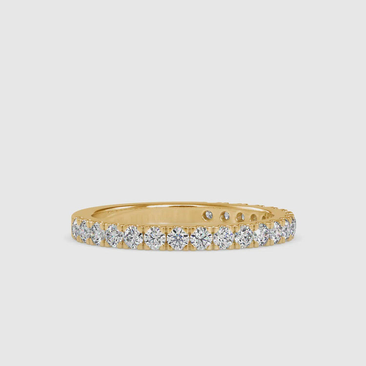 Diamondrensu wedding band with round diamonds in a gold semi eternity design.