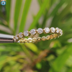 Yellow gold eternity band with a classic and modern design.