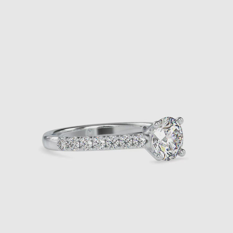 Round diamond engagement ring with a cathedral style setting and IGI certified diamond.

