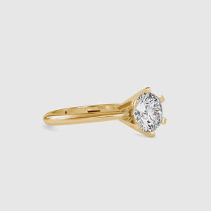 Round diamond engagement ring in white gold with solitaire setting
